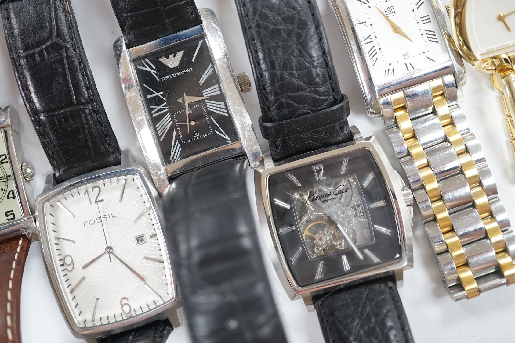 Eight assorted lady's and gentleman's modern wrist watches including Emporio Armani, Esq and Fossil. Condition - poor to fair
